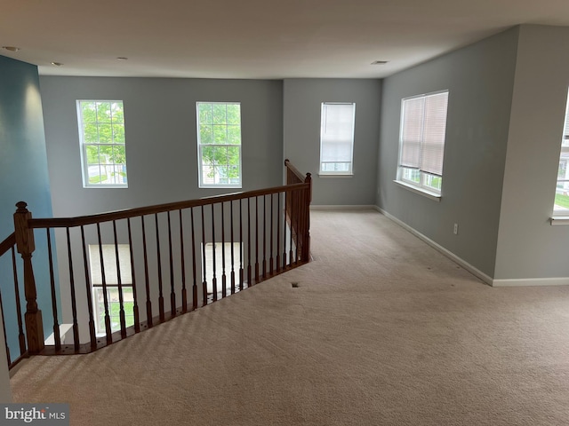 16258 John Rowland Trl, Milton, DE 19968 - hallway with carpet, baseboards, and an upstairs landing