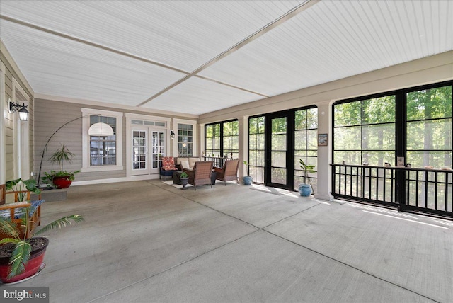 unfurnished sunroom featuring french doors