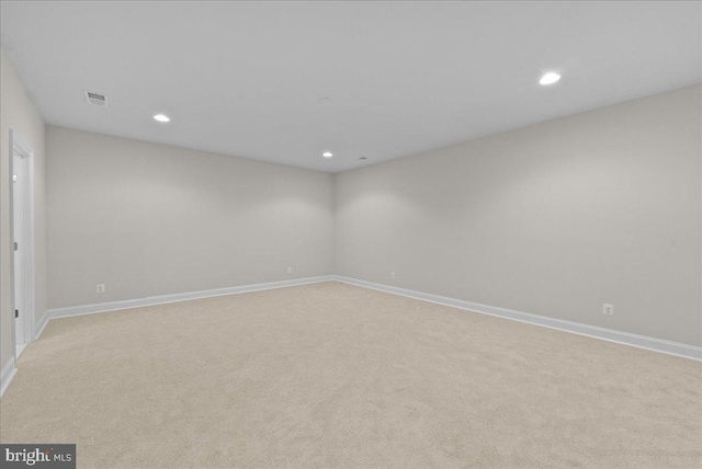 unfurnished room with baseboards, visible vents, recessed lighting, and light colored carpet