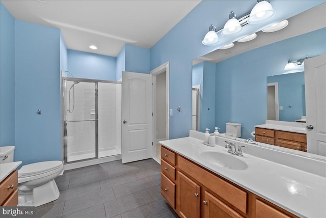 full bathroom with vanity, tile patterned floors, toilet, and a shower stall