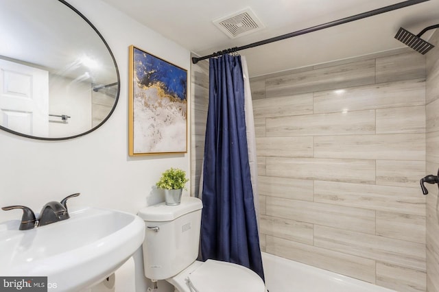 805 Cator Ave, Baltimore, MD 21218 - full bath featuring a sink, toilet, and visible vents