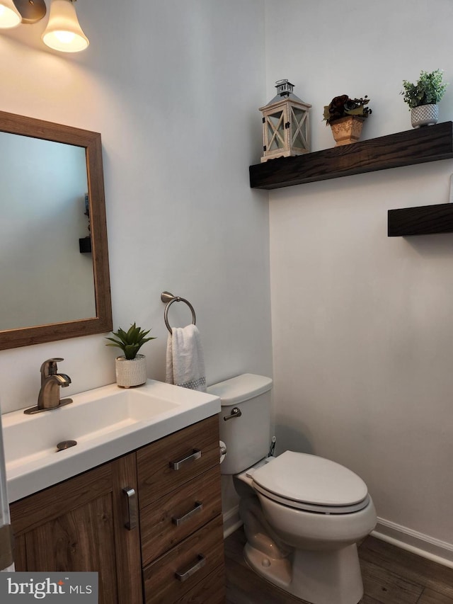 4480 Weejun Loop, Woodbridge, VA 22192 - bathroom featuring toilet, baseboards, vanity, and wood finished floors