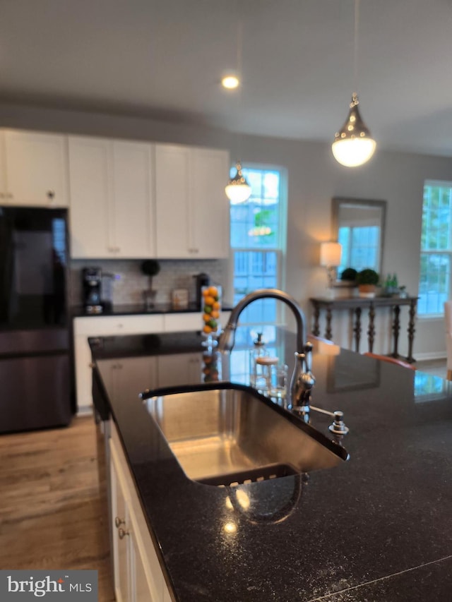 4480 Weejun Loop, Woodbridge, VA 22192 - kitchen with a sink, freestanding refrigerator, white cabinetry, recessed lighting, and dark stone counters