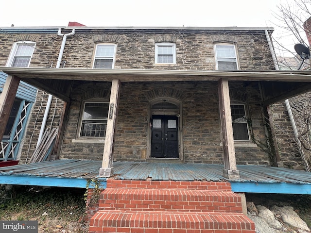 5927 Wayne Ave, Philadelphia, PA 19144 - property entrance with stone siding and covered porch
