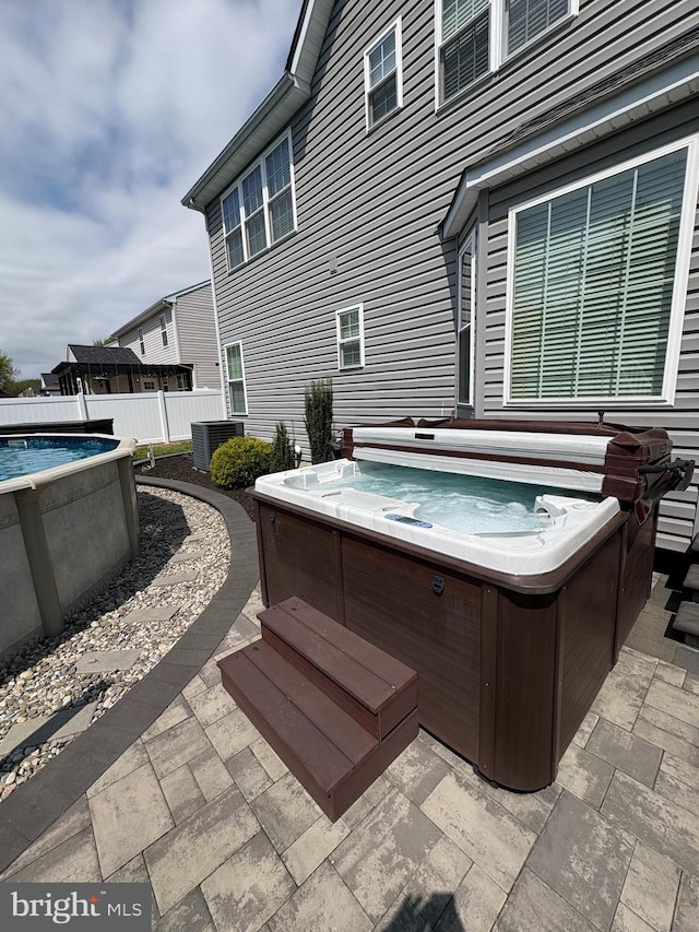 362 Hoffeckers Mill Dr, Smyrna, DE 19977 - view of patio with a hot tub and fence