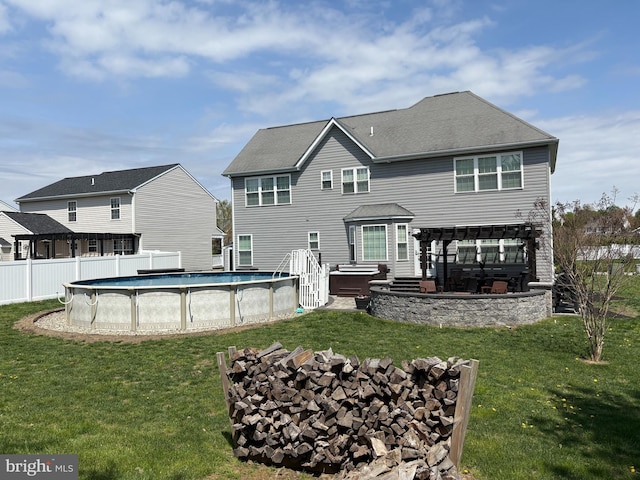 362 Hoffeckers Mill Dr, Smyrna, DE 19977 - rear view of property featuring a jacuzzi and an outdoor pool