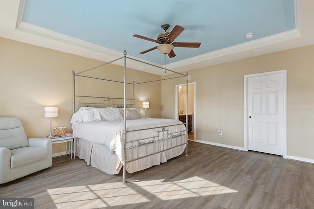 bedroom featuring baseboards, ornamental molding, ceiling fan, and wood finished floors