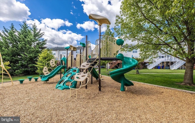 community jungle gym featuring a yard