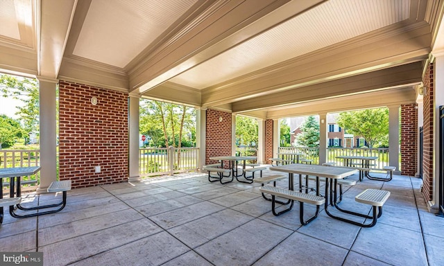 view of patio / terrace featuring fence and outdoor dining area