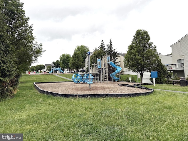 community jungle gym with a lawn