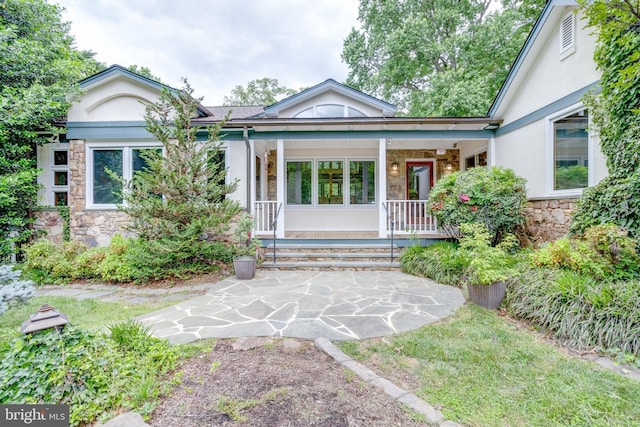 8604 Tobin Rd, Annandale, VA 22003 - entrance to property with stone siding, stucco siding, and a porch