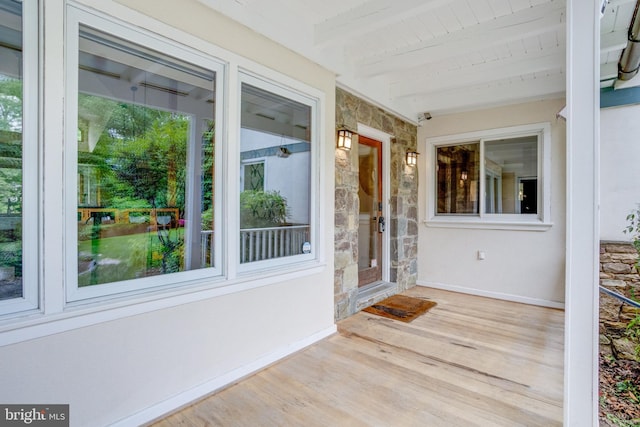 8604 Tobin Rd, Annandale, VA 22003 - unfurnished sunroom featuring wood finished floors, beam ceiling, and baseboards