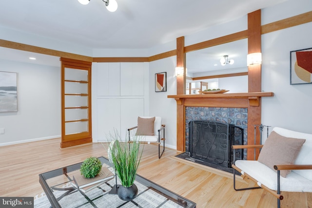 8604 Tobin Rd, Annandale, VA 22003 - living room with wood finished floors, a tile fireplace, baseboards, and recessed lighting