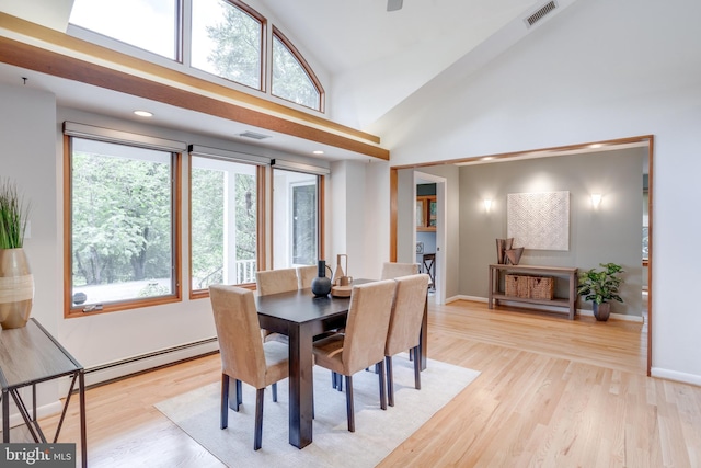 8604 Tobin Rd, Annandale, VA 22003 - dining space with light wood-type flooring, high vaulted ceiling, baseboards, and baseboard heating