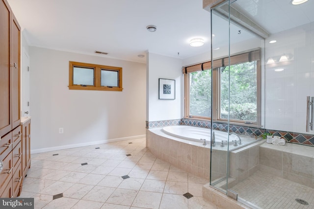 8604 Tobin Rd, Annandale, VA 22003 - full bath with a garden tub, tile patterned floors, baseboards, and a stall shower