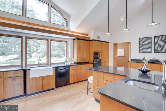 8604 Tobin Rd, Annandale, VA 22003 - kitchen with black appliances, a sink, high vaulted ceiling, dark stone countertops, and decorative light fixtures