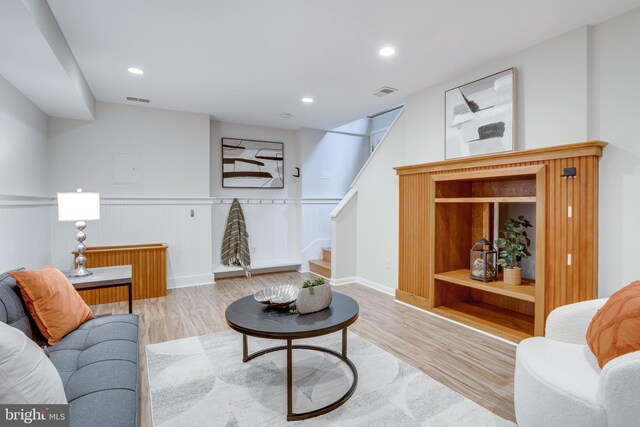 8604 Tobin Rd, Annandale, VA 22003 - living room with wood finished floors, stairway, wainscoting, and recessed lighting