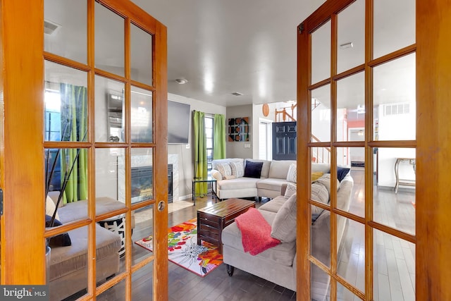 sunroom with visible vents and french doors