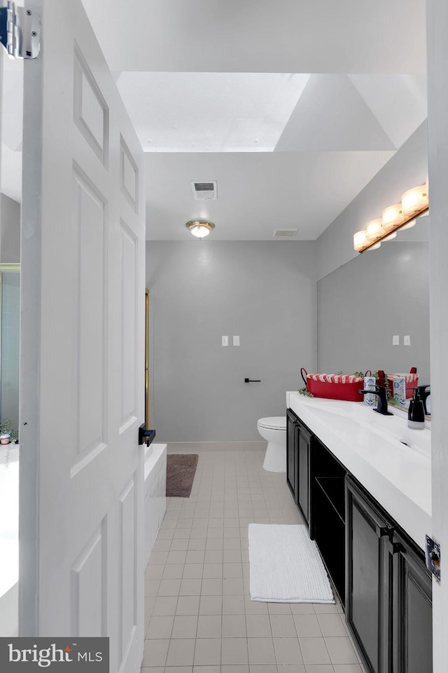 full bath featuring vanity, visible vents, toilet, and tile patterned flooring