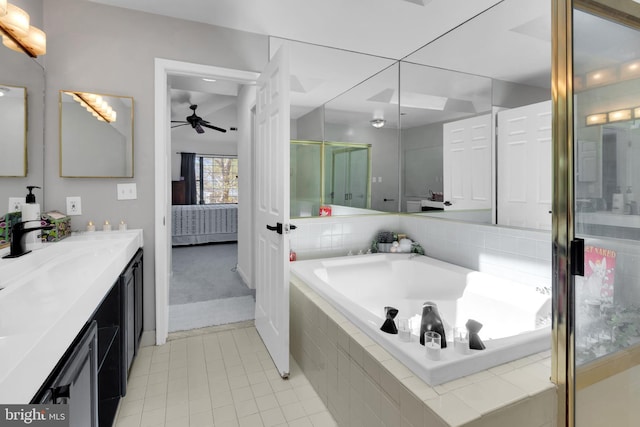 full bath with tile patterned floors, ensuite bathroom, vanity, a ceiling fan, and a garden tub