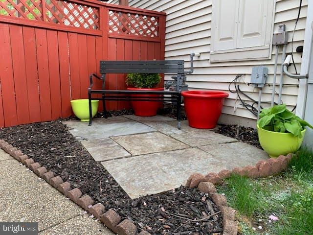 view of patio / terrace featuring fence