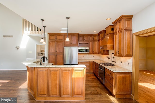kitchen with brown cabinetry, appliances with stainless steel finishes, dark wood-style floors, and visible vents