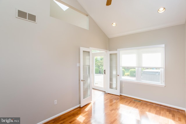 spare room featuring visible vents, baseboards, recessed lighting, french doors, and light wood finished floors