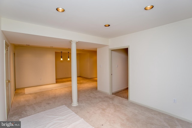 finished basement with baseboards, light carpet, and recessed lighting