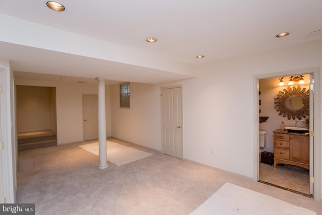 finished basement featuring light colored carpet and recessed lighting