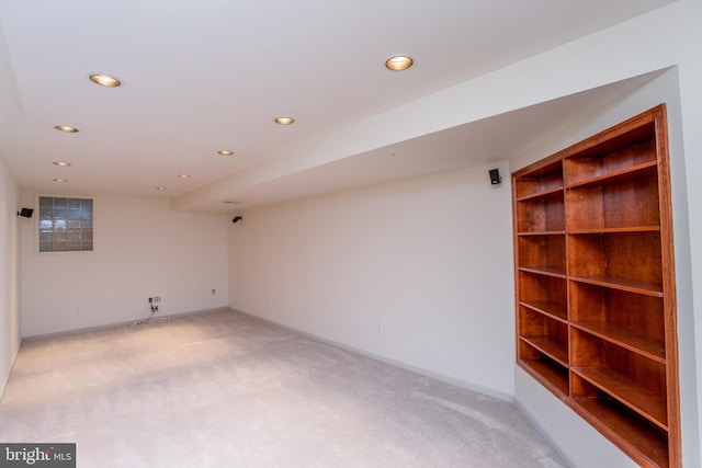 finished below grade area with recessed lighting and light colored carpet