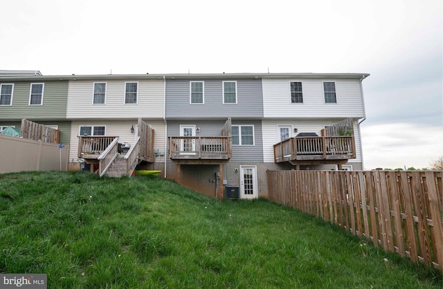 112 Ryder Benson Ln, Front Royal, VA 22630 - back of property with a lawn, fence, central air condition unit, and a deck