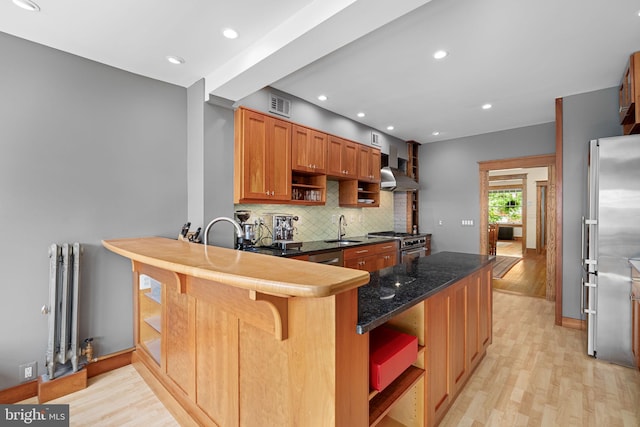 kitchen featuring visible vents, open shelves, radiator, a sink, and light wood finished floors