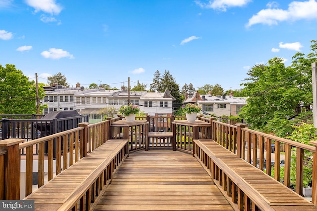 wooden terrace with a residential view