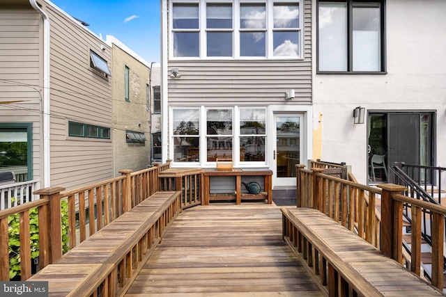 rear view of house featuring a deck