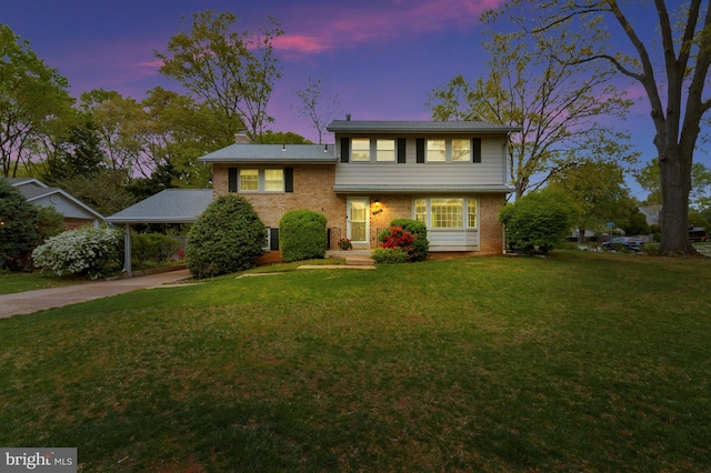 4200 Sandhurst Ct, Annandale, VA 22003 - split level home featuring brick siding, driveway, a front yard, and a chimney
