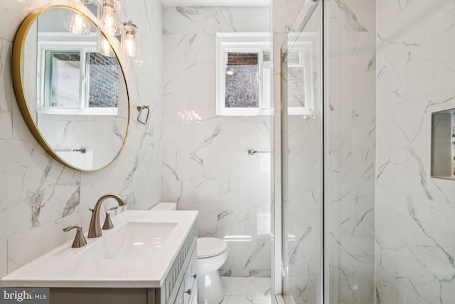 bathroom with a marble finish shower, toilet, tile walls, vanity, and marble finish floor