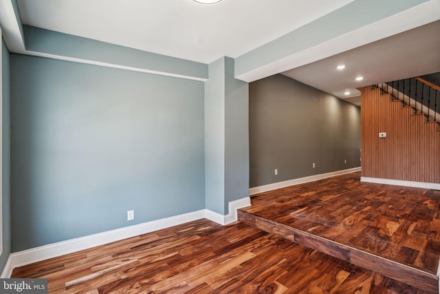 interior space with recessed lighting, stairs, wood finished floors, and baseboards
