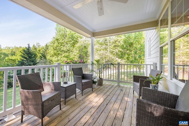 wooden deck featuring ceiling fan