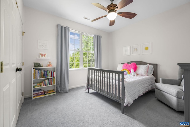 bedroom with carpet flooring, baseboards, visible vents, and ceiling fan