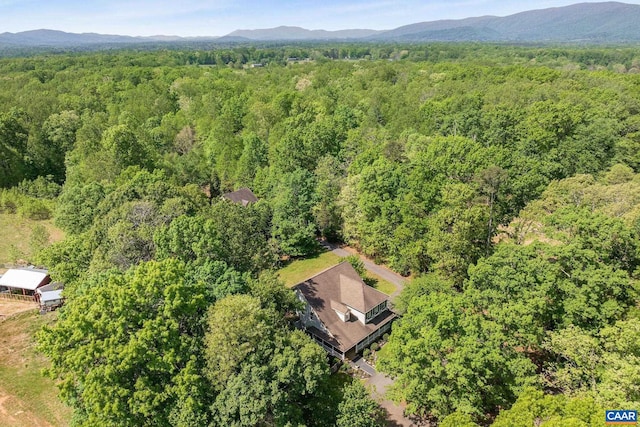 bird's eye view with a forest view and a mountain view