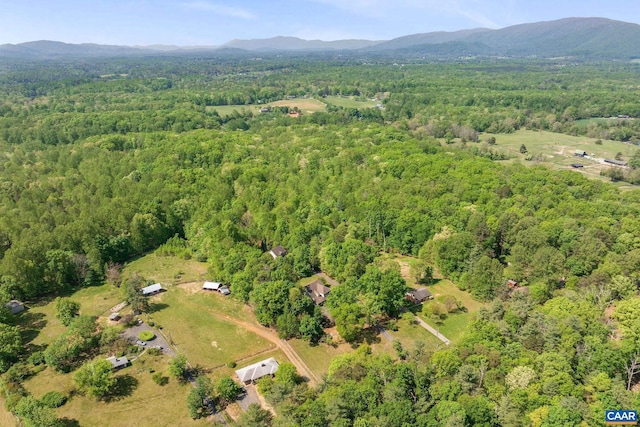 bird's eye view featuring a forest view and a mountain view