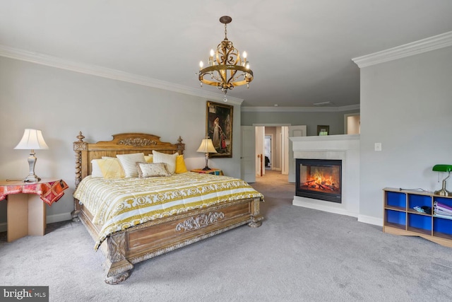 bedroom featuring carpet flooring, a chandelier, ornamental molding, a glass covered fireplace, and baseboards