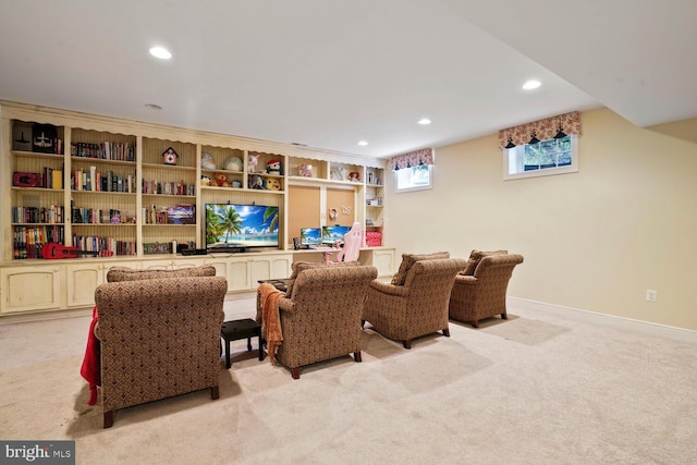 living area with light carpet, recessed lighting, and baseboards