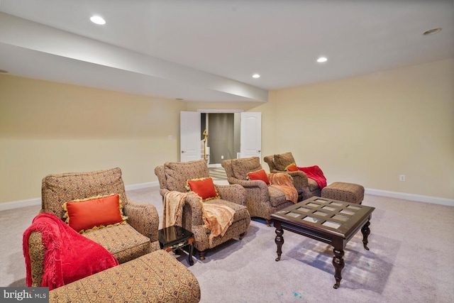 living area featuring carpet floors, baseboards, and recessed lighting