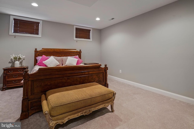 bedroom with light carpet, recessed lighting, and baseboards