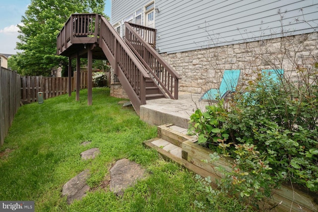 view of yard with stairs and a deck
