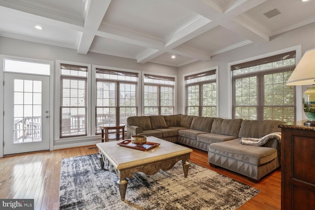 living area with beamed ceiling, coffered ceiling, light wood-style floors, recessed lighting, and ornamental molding