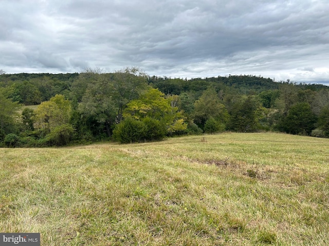 view of landscape with a view of trees and a rural view