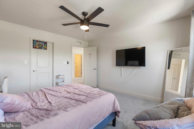 carpeted bedroom featuring a ceiling fan, baseboards, and visible vents