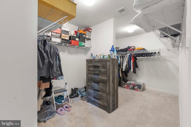 walk in closet featuring carpet flooring and visible vents